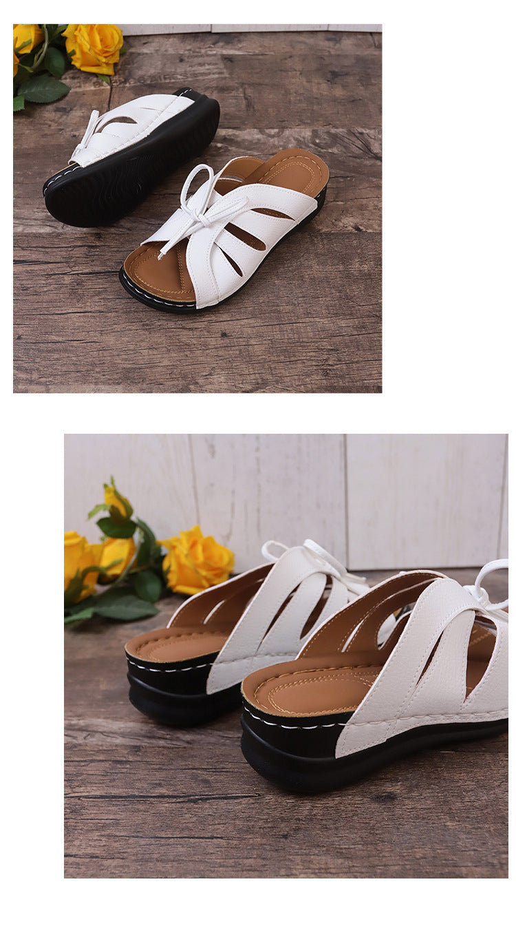 Sandalias de cuña plana con lazo calado